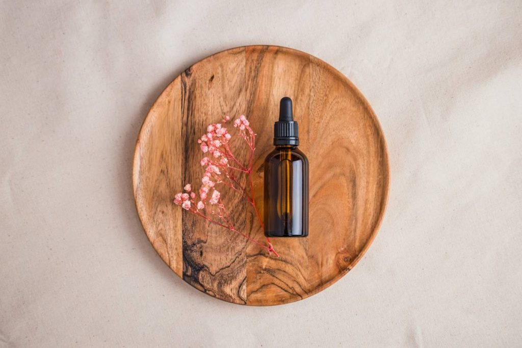 a bottle of perfume on a wooden table