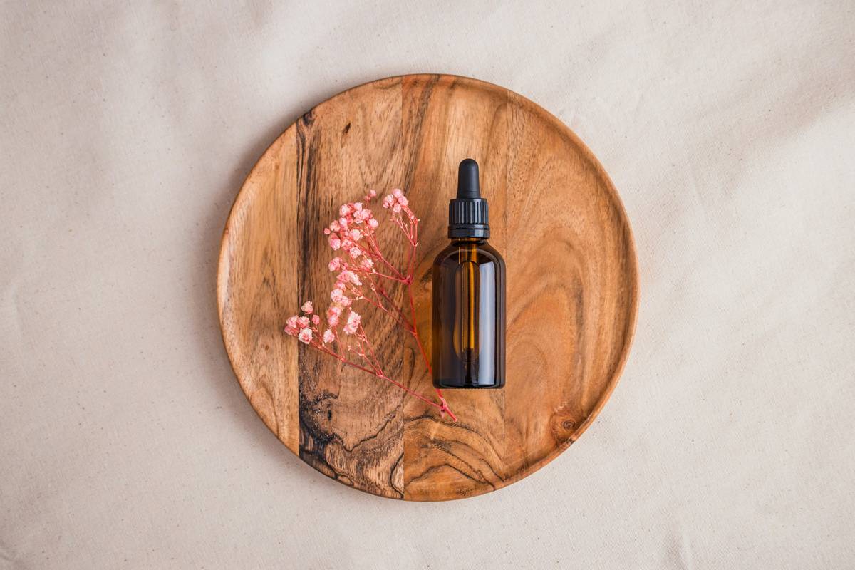 a bottle of perfume on a wooden table