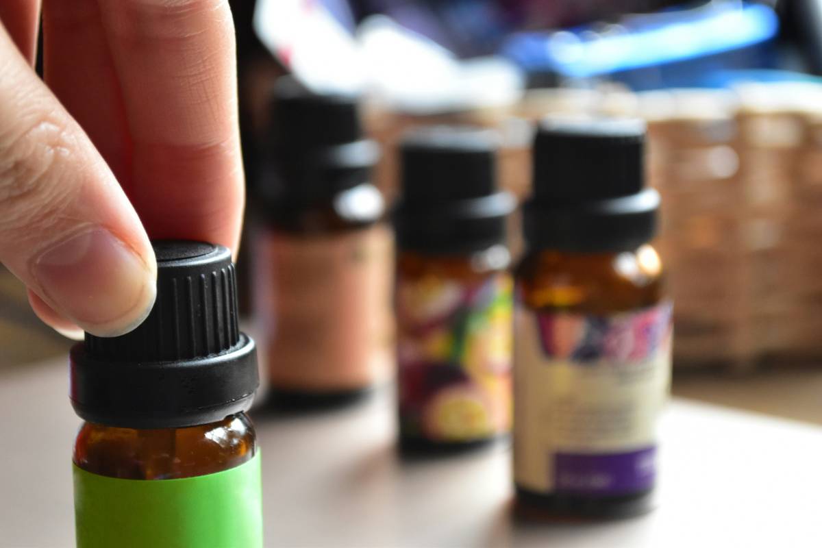 Aromatherapy skincare routine showing how to use aromatherapy essential oils with roller bottle and linen cloth