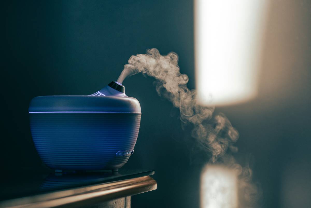Custom aromatherapy mist being spritzed during morning routine showing how aromatherapy routine can be delivered via water-based method